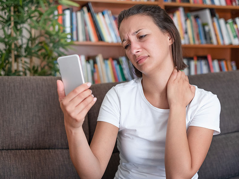 woman during a virtual doctor visit on her cellphone