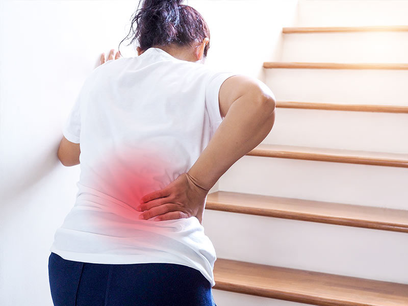 woman climbing stairs with myelopathy