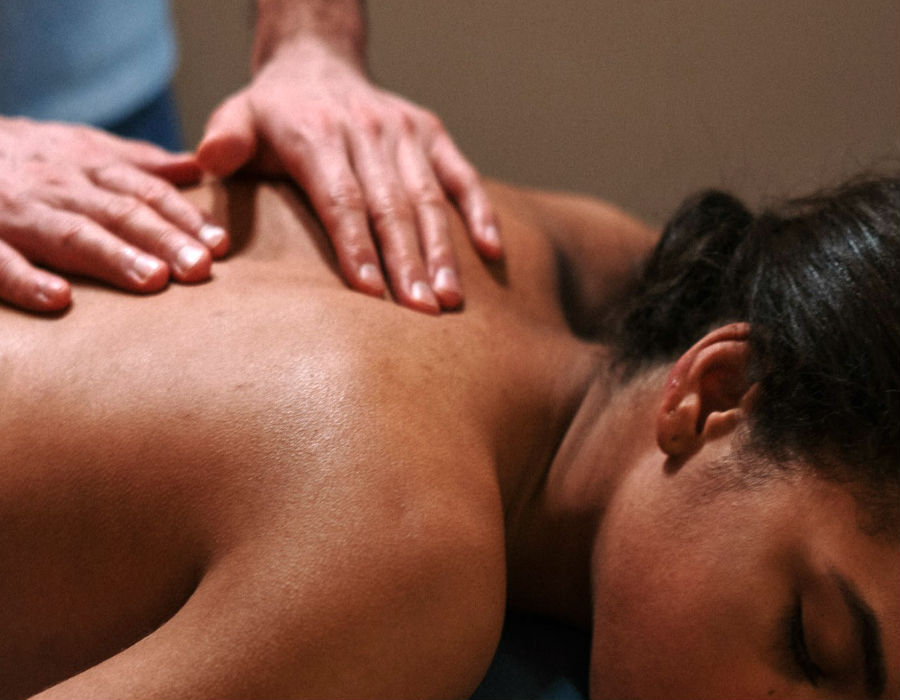 woman with large breasts in back pain