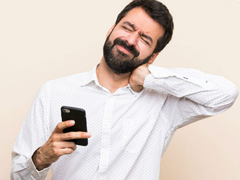 man on cellphone with text neck pain